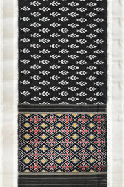 Ikat pure silk saree in black with floral motifs  and silver borders.