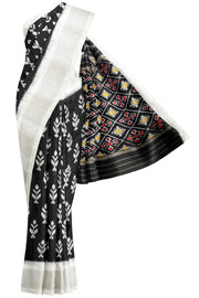 Ikat pure silk saree in black with floral motifs  and silver borders.