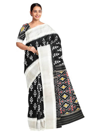 Ikat pure silk saree in black with floral motifs  and silver borders.