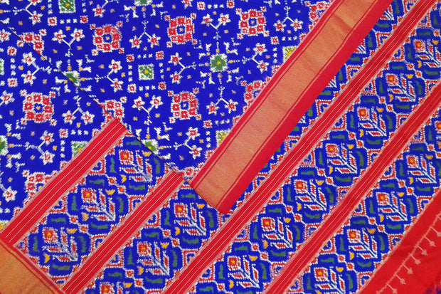 Double ikat pure silk saree in royal blue in  navaratan pattern.