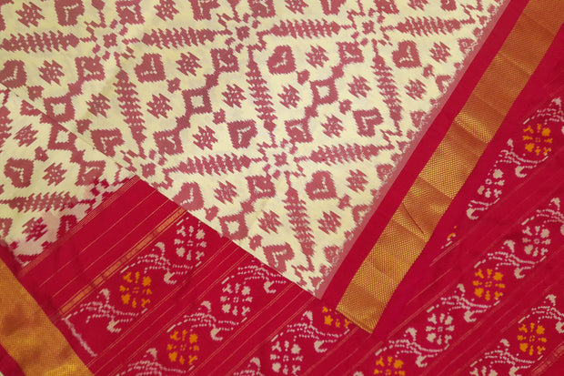 Ikat pure silk saree in off white in pan bhat pattern .