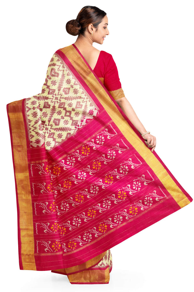 Ikat pure silk saree in off white in pan bhat pattern .