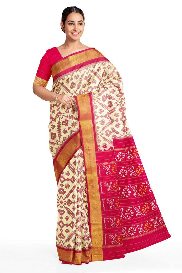 Ikat pure silk saree in off white in pan bhat pattern .