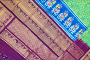 Ikat pure silk saree in rexona green with elephant motifs in skirt border.