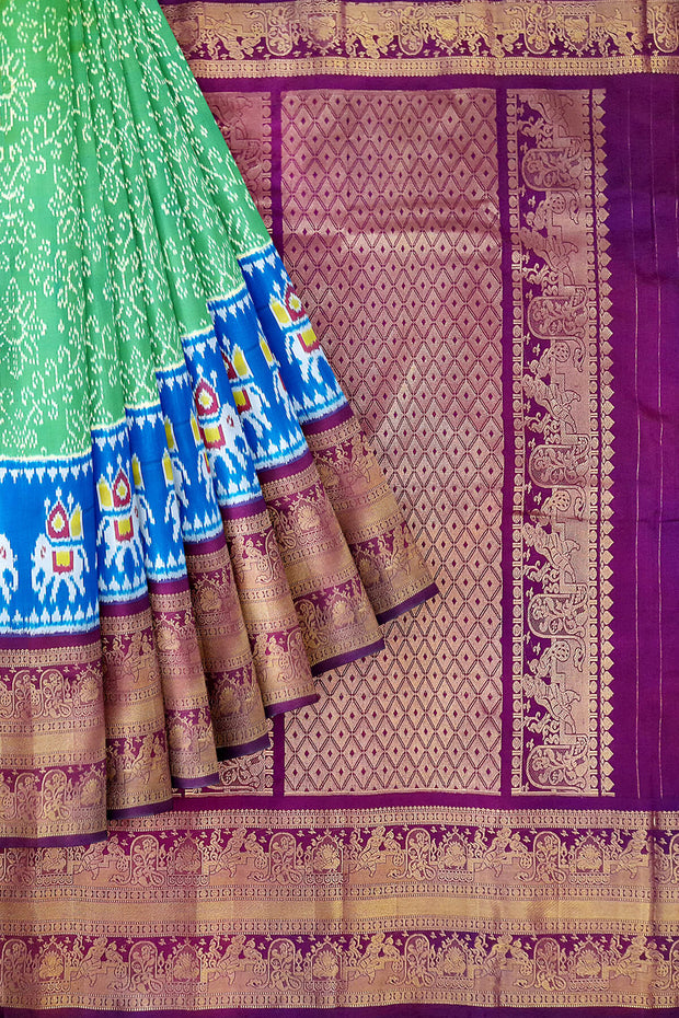 Ikat pure silk saree in rexona green with elephant motifs in skirt border.