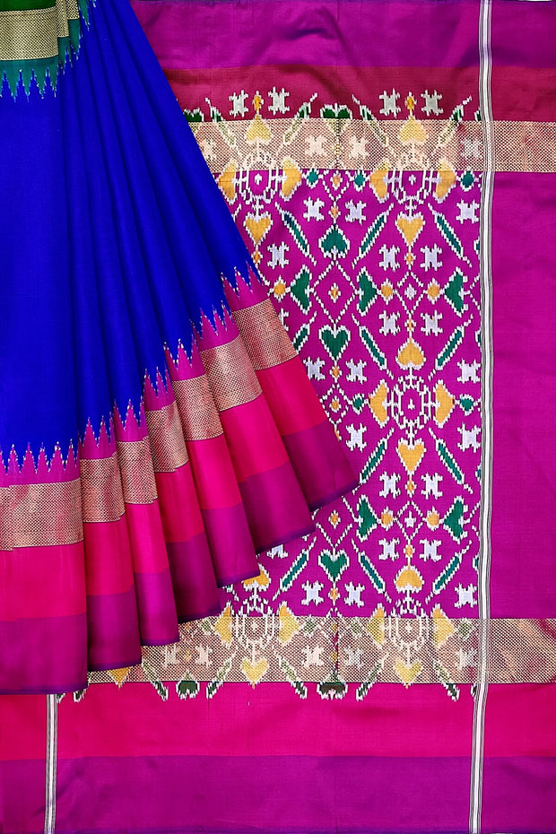 Handwoven Ikat pure silk  saree in royal blue with Ganga Jamuna  temple zari border .