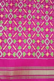 Handwoven Ikat pure silk saree in fine checks in green with elephant motifs in skirt border