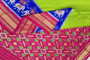 Handwoven Ikat pure silk saree in fine checks in green with elephant motifs in skirt border
