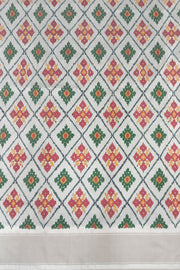 Ikat pure silk sare in dark green in chokta bhat pattern and tissue borders.