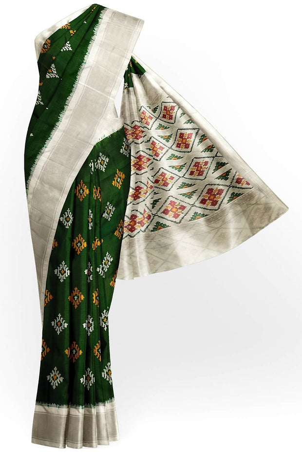 Ikat pure silk sare in dark green in chokta bhat pattern and tissue borders.