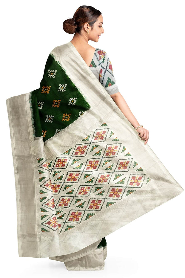 Ikat pure silk sare in dark green in chokta bhat pattern and tissue borders.