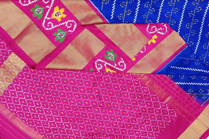 Handwoven Ikat pure silk saree in blue with diagonal lines and floral  motifs in skirt border.
