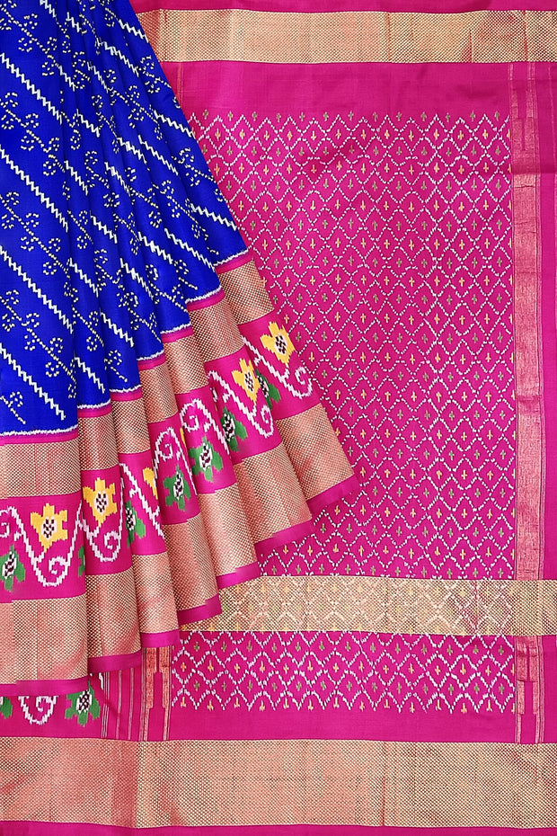 Handwoven Ikat pure silk saree in blue with diagonal lines and floral  motifs in skirt border.