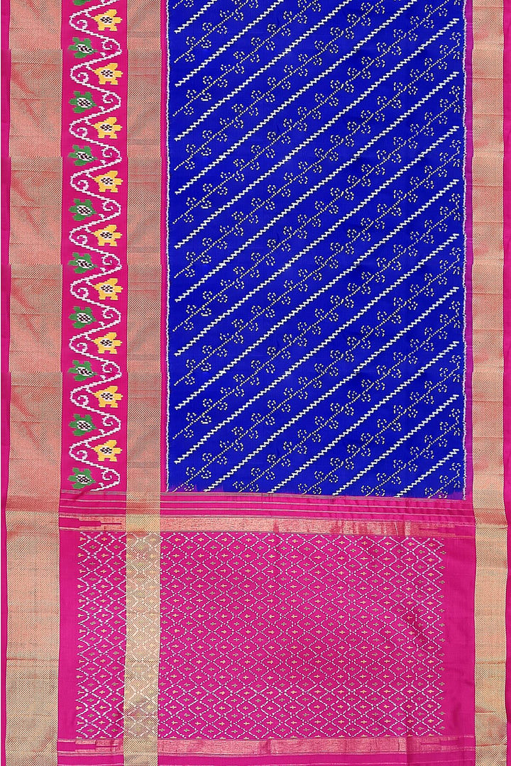 Handwoven Ikat pure silk saree in blue with diagonal lines and floral  motifs in skirt border.