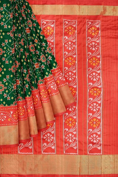 Handwoven Ikat pure silk saree in bottle green in navratan pattern.