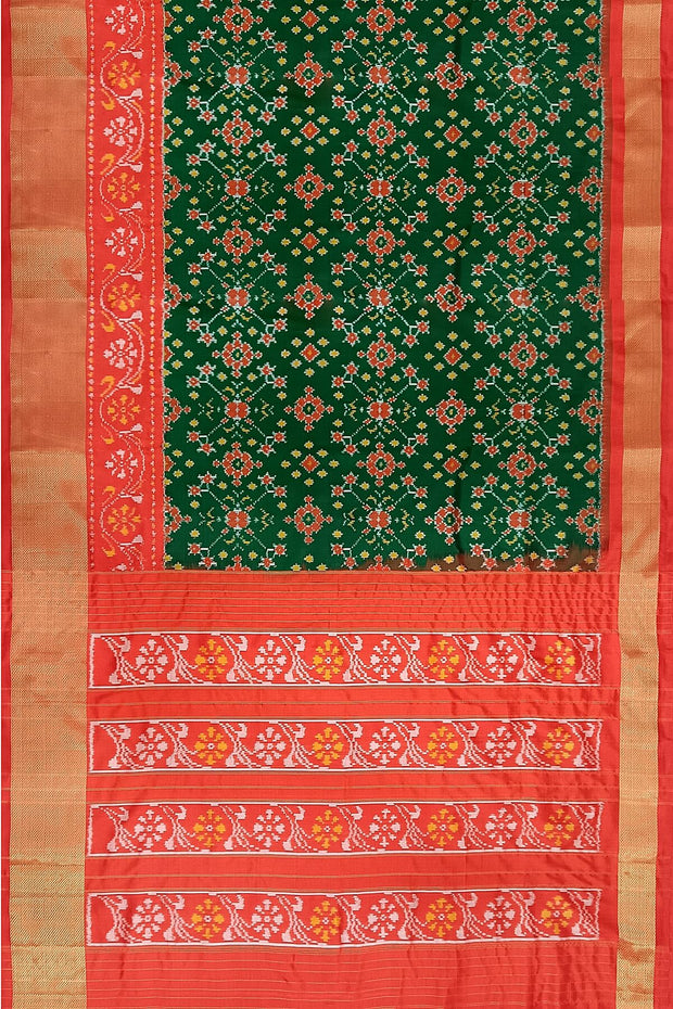 Handwoven Ikat pure silk saree in bottle green in navratan pattern.