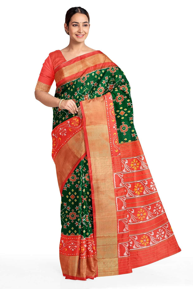 Handwoven Ikat pure silk saree in bottle green in navratan pattern.