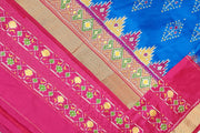 Handowoven ikat pure silk saree  in blue with  floral motifs  and a temple border.