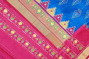 Handowoven ikat pure silk saree  in blue with  floral motifs  and a temple border.