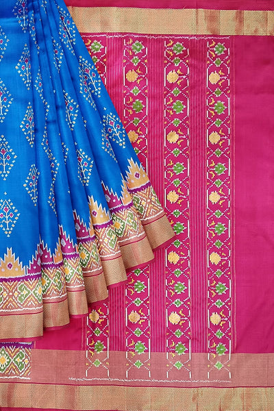 Handowoven ikat pure silk saree  in blue with  floral motifs  and a temple border.