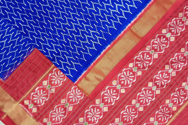 Handwoven ikat pure silk saree in geometric pattern pattern with floral motifs in pallu.