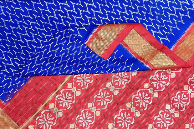 Handwoven ikat pure silk saree in geometric pattern pattern with floral motifs in pallu.