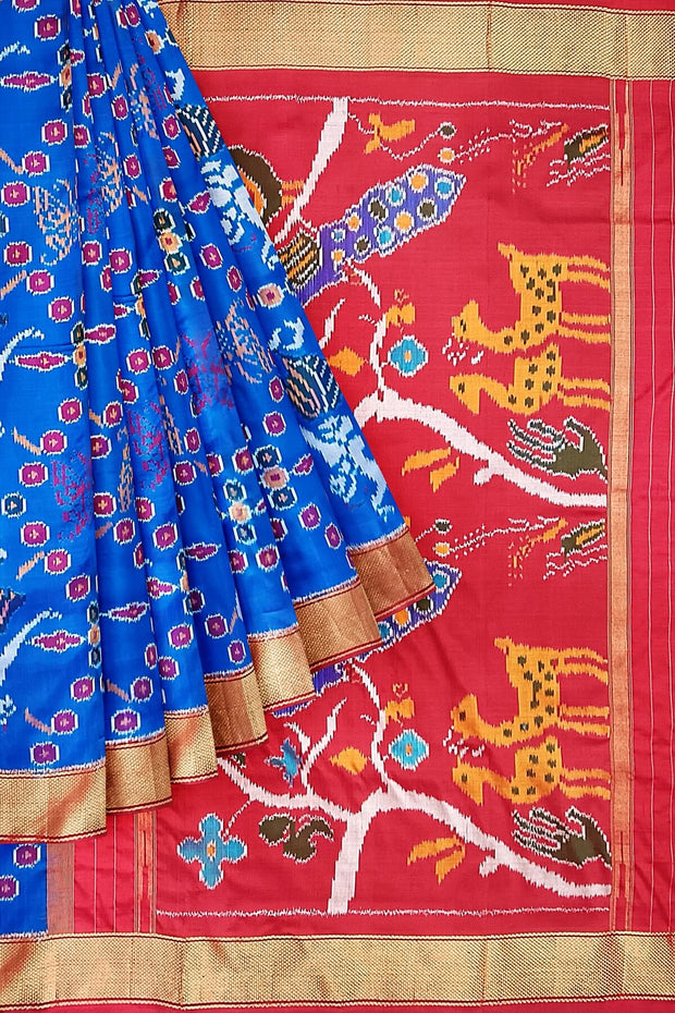 Handwoven Ikat pure silk saree in copper sulphate blue with dancing images .