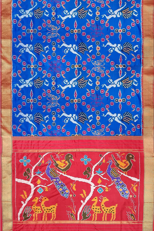 Handwoven Ikat pure silk saree in copper sulphate blue with dancing images .