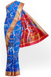 Handwoven Ikat pure silk saree in copper sulphate blue with dancing images .