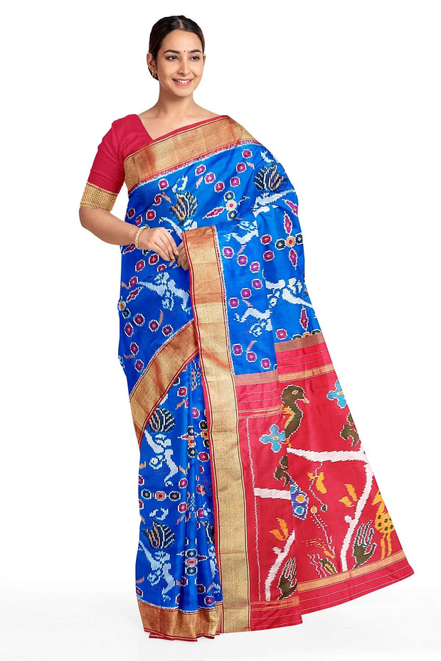 Handwoven Ikat pure silk saree in copper sulphate blue with dancing images .