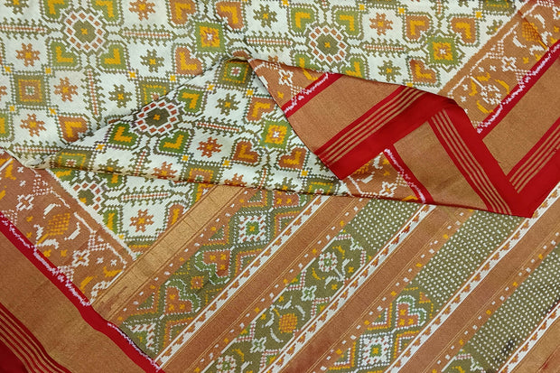 Ikat silk tissue saree in off white & red in pan bhat pattern