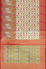 Ikat silk tissue saree in off white  in narikunj pattern and a contrast pallu.