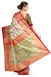 Ikat silk tissue saree in off white  in narikunj pattern and a contrast pallu.