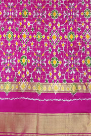 Handwoven ikat pure silk saree in bottle green in fine checks with bird motifs in skirt border .