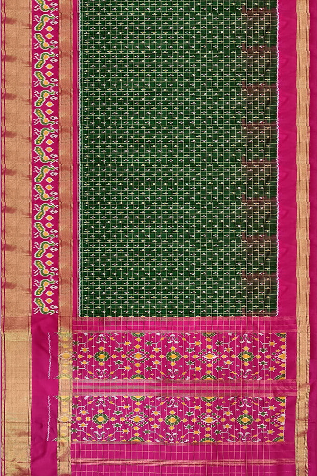 Handwoven ikat pure silk saree in bottle green in fine checks with bird motifs in skirt border .