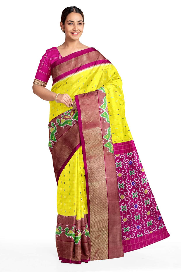 Handwoven ikat pure silk saree in  yellow in fine checks with bird motifs in skirt border