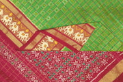 Handwoven ikat pure silk saree in green  in fine checks with elephant motifs in skirt border