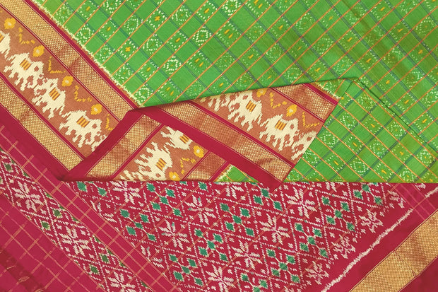 Handwoven ikat pure silk saree in green  in fine checks with elephant motifs in skirt border