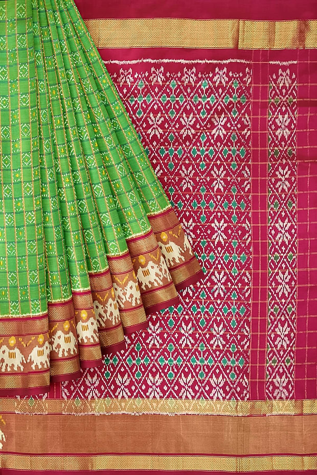 Handwoven ikat pure silk saree in green  in fine checks with elephant motifs in skirt border