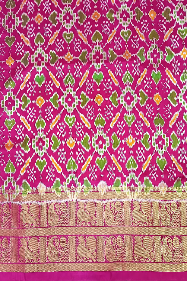 Handwoven ikat pure silk saree in green in navratan pattern