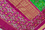 Handwoven ikat pure silk saree in green in navratan pattern