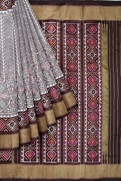 Handwoven ikat pure silk saree  in mauve  in  combination of diamond &  pan bhat patterns.