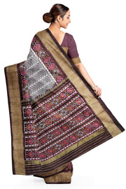 Handwoven ikat pure silk saree  in mauve  in  combination of diamond &  pan bhat patterns.