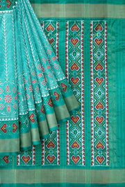 Handwoven ikat pure silk saree  in teal green  in  combination of diamond &  pan bhat patterns.