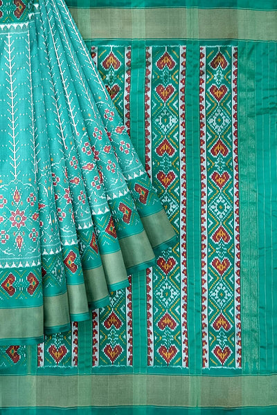 Handwoven ikat pure silk saree  in teal green  in  combination of diamond &  pan bhat patterns.