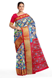 Ikat pure silk saree in double shaded blue with plant & animal pattern on  the body.