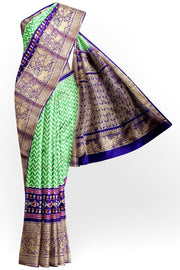 Ikat pure silk saree in mint green with wave pattern .