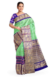 Ikat pure silk saree in mint green with wave pattern .