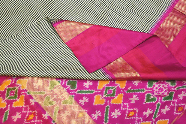 Handwoven Ikat silk saree in black  in fine checks with patola pattern pallu & blouse.
