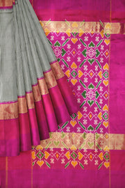 Handwoven Ikat silk saree in black  in fine checks with patola pattern pallu & blouse.